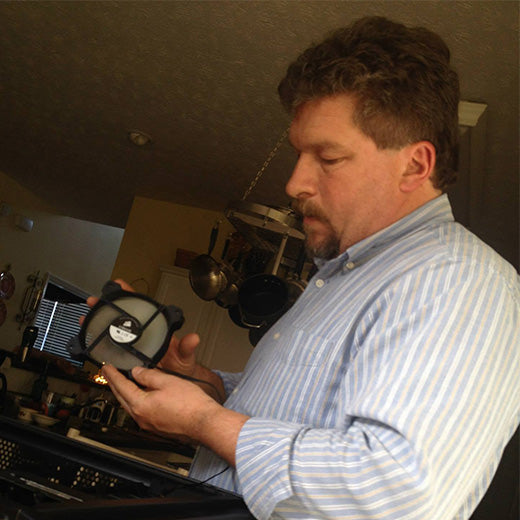 A dad helping build a computer